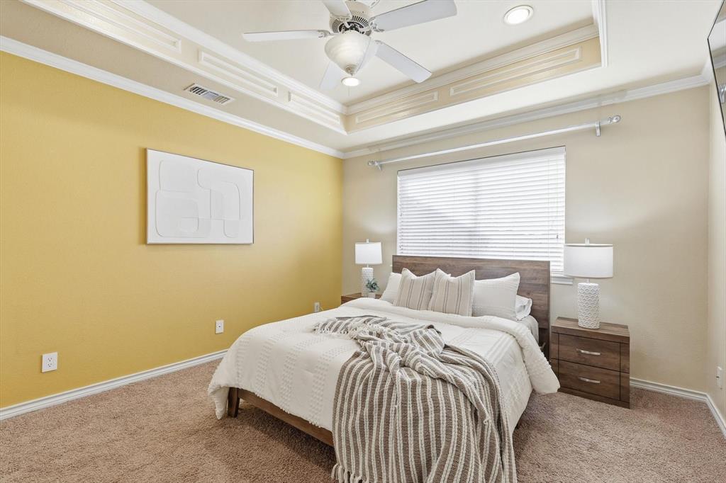727 Madison Street Coppell, TX 75019 - Photo 24 of 36 a bedroom with a bed and window