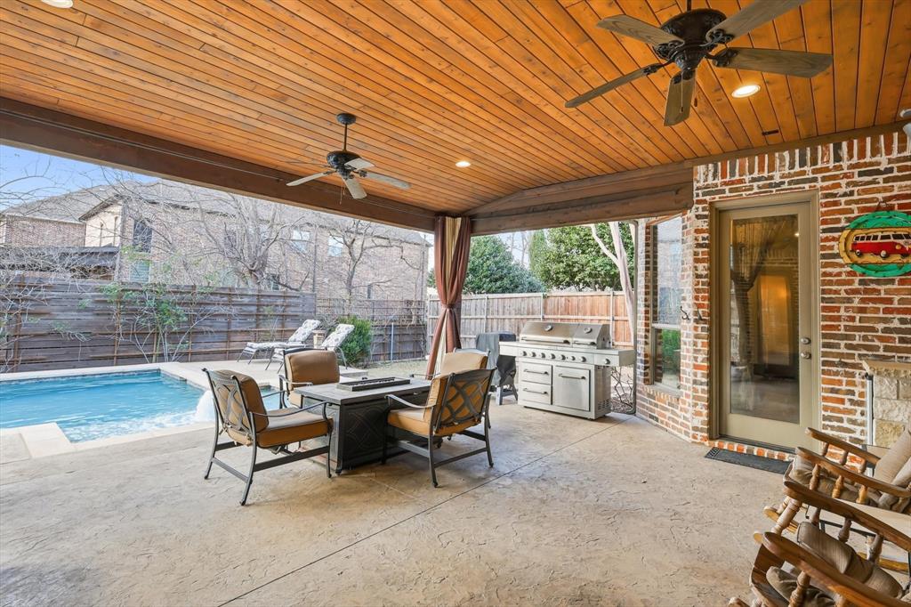 727 Madison Street Coppell, TX 75019 - Photo 28 of 36 a outdoor space with the couches and dining table with the garden view