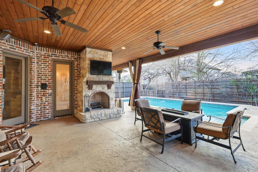 727 Madison Street Coppell, TX 75019 - Photo 29 of 36 a view of a patio with furniture and a fireplace