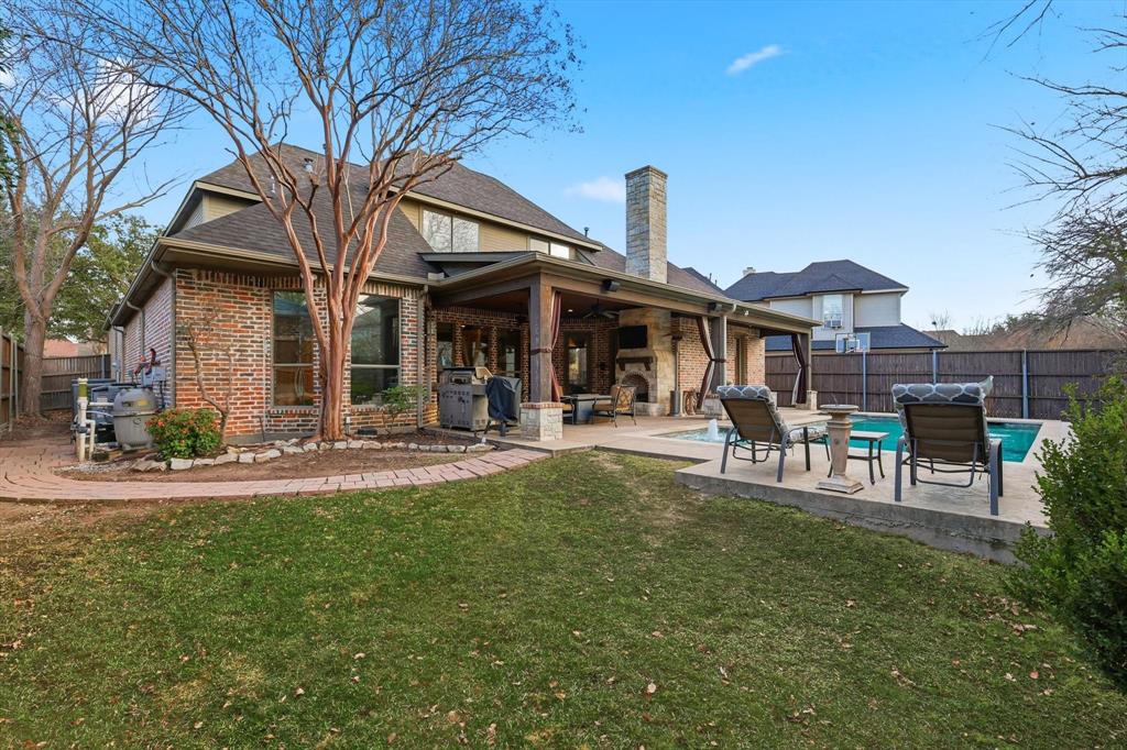 727 Madison Street Coppell, TX 75019 - Photo 32 of 36 a front view of a building with dining table and chairs