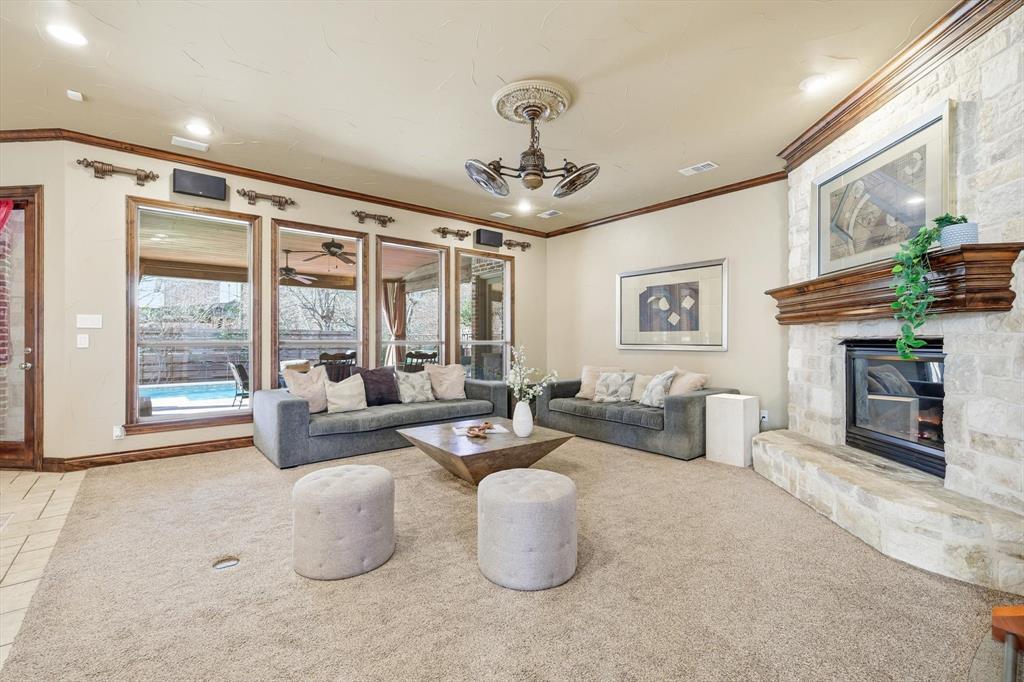 727 Madison Street Coppell, TX 75019 - Photo 8 of 36 a living room with furniture and a fireplace
