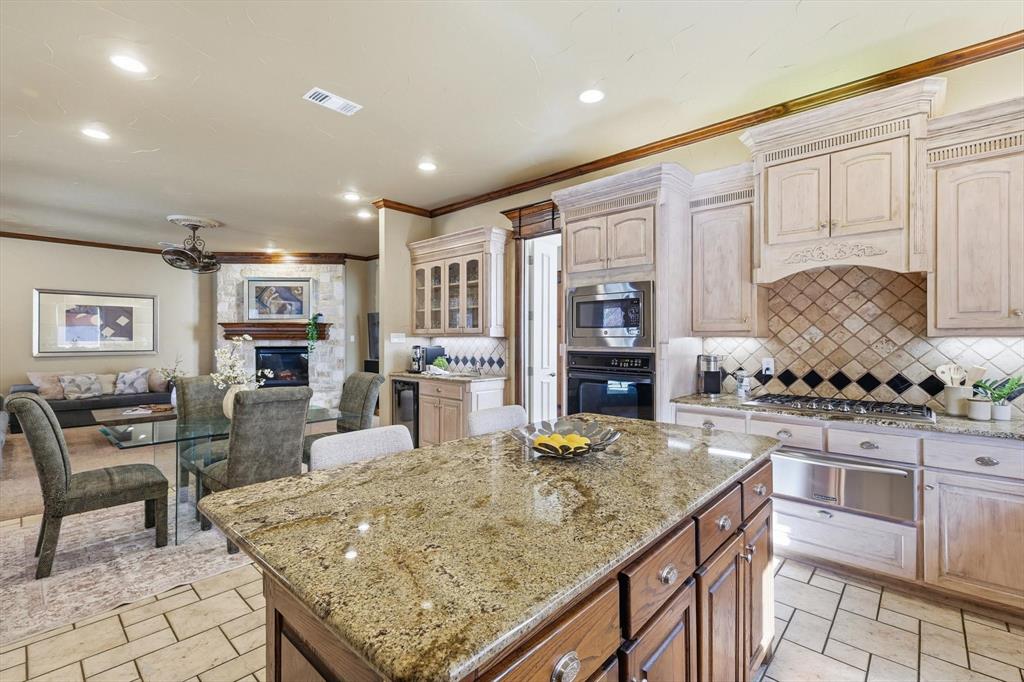 727 Madison Street Coppell, TX 75019 - Photo 10 of 36 a kitchen with granite countertop lots of counter top space