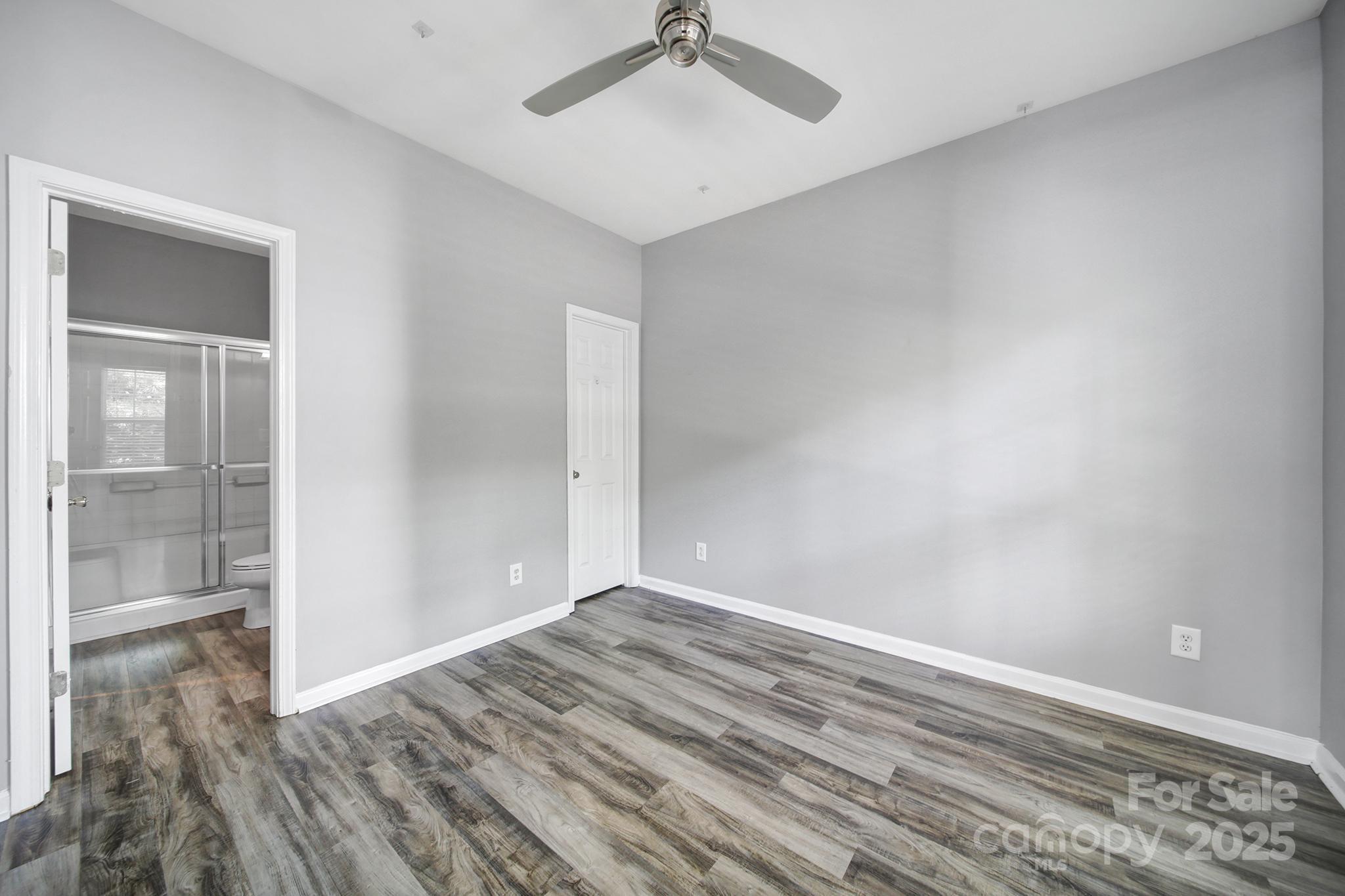 13719 Singleleaf Lane Charlotte, NC 28278 - Photo 17 of 42 a view of room with wooden floor and fan