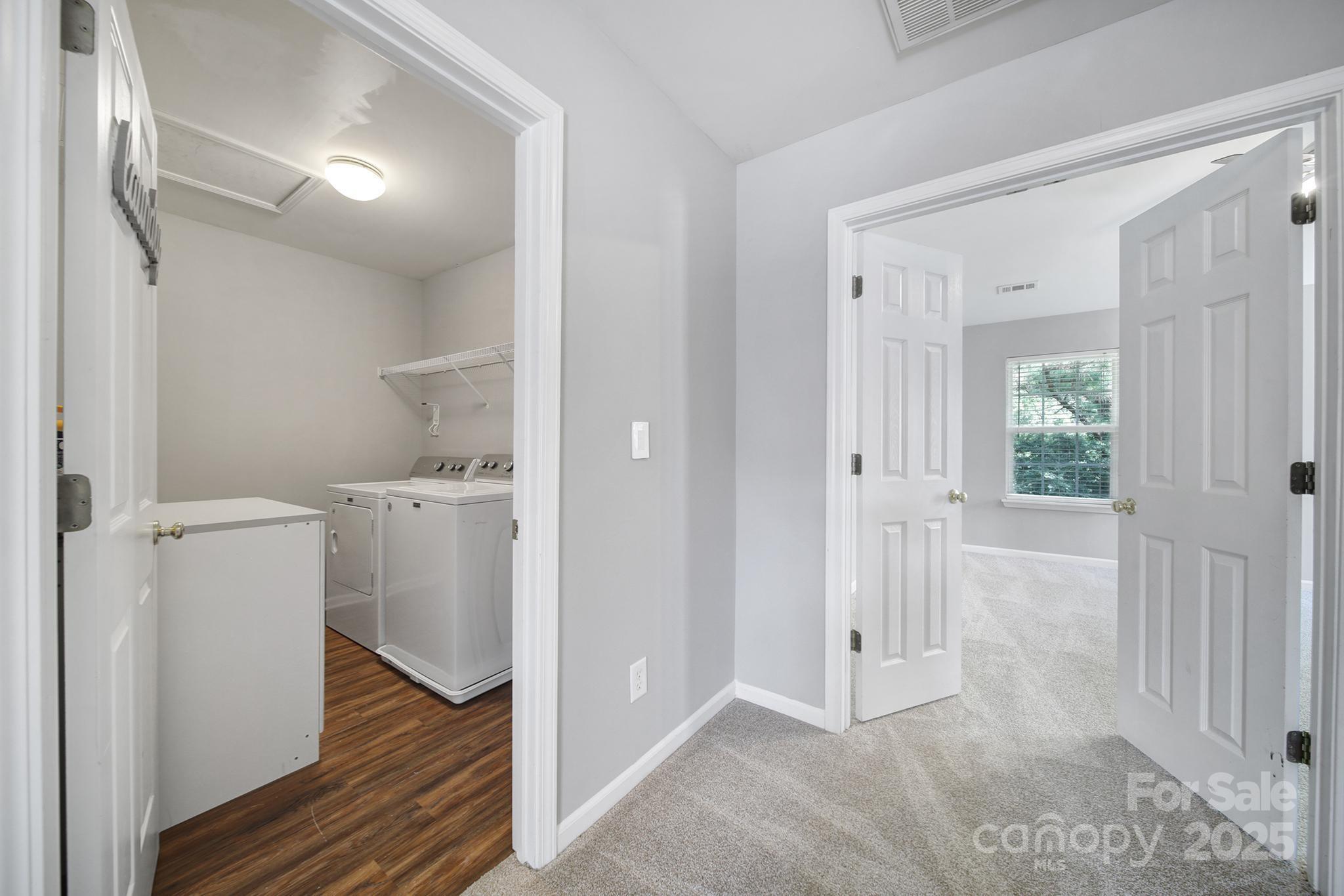13719 Singleleaf Lane Charlotte, NC 28278 - Photo 20 of 42 a view of a room with wooden floor and a bathroom