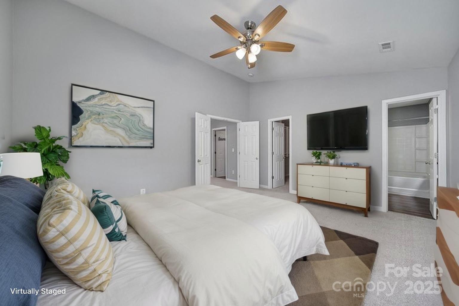13719 Singleleaf Lane Charlotte, NC 28278 - Photo 22 of 42 a bedroom with a bed and a television