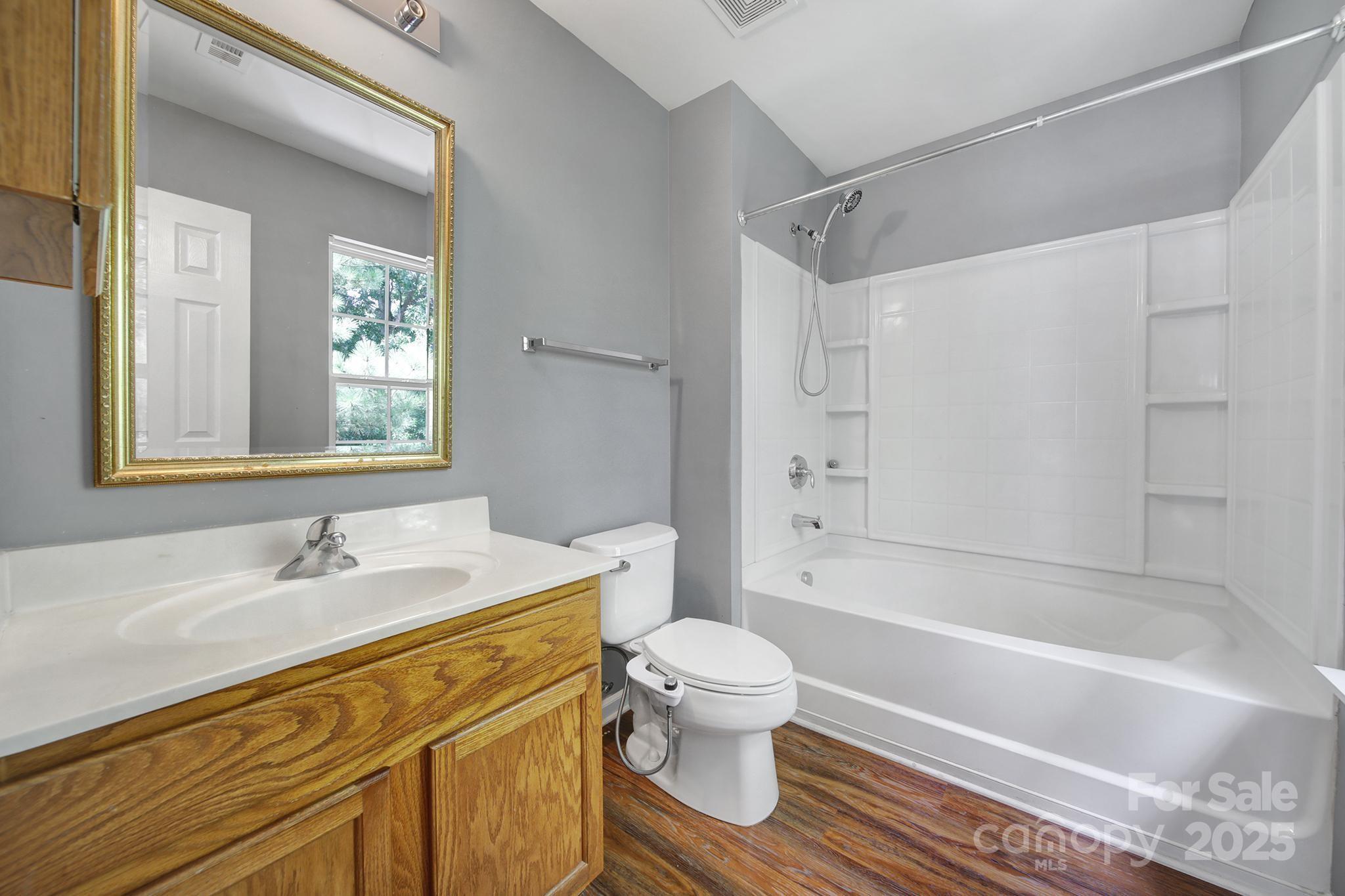 13719 Singleleaf Lane Charlotte, NC 28278 - Photo 25 of 42 a bathroom with a sink toilet and shower