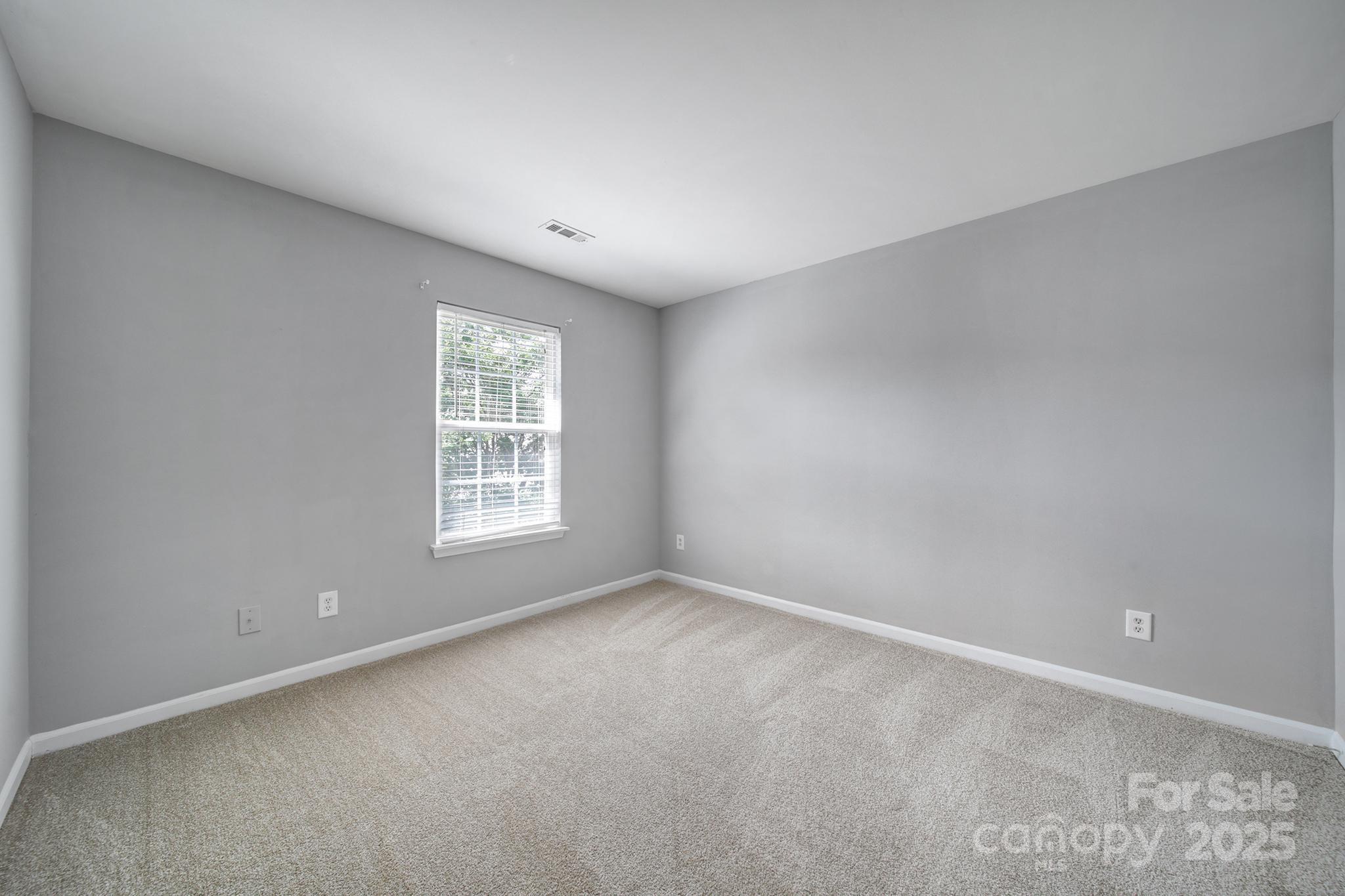13719 Singleleaf Lane Charlotte, NC 28278 - Photo 29 of 42 a view of an empty room with a window