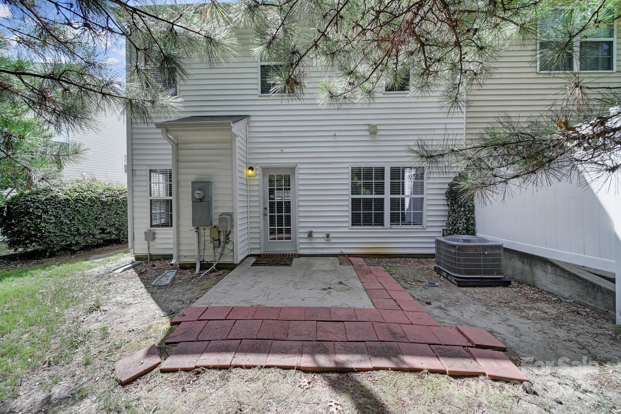 13719 Singleleaf Lane Charlotte, NC 28278 - Photo 33 of 42 a front view of a house with a yard