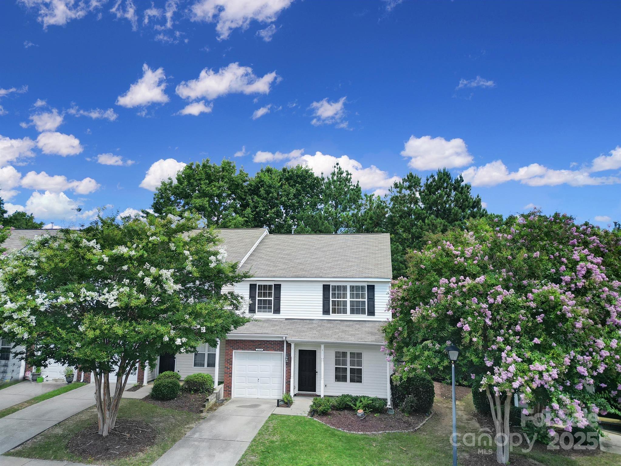 13719 Singleleaf Lane Charlotte, NC 28278 - Photo 35 of 42 a view of a white house with a big yard and large tree