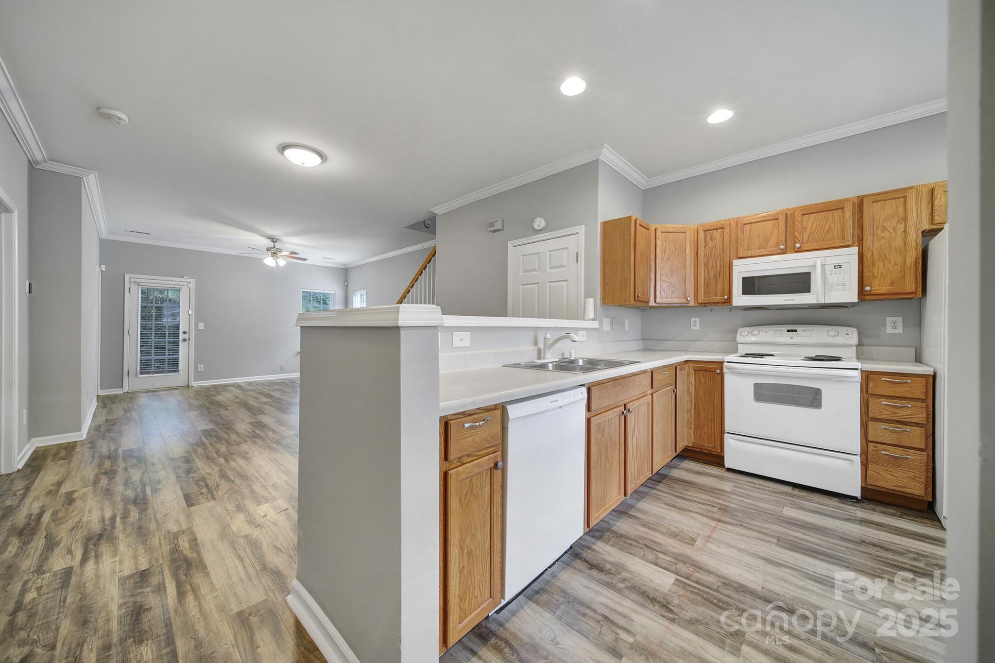 13719 Singleleaf Lane Charlotte, NC 28278 - Photo 5 of 42 a kitchen with stainless steel appliances a refrigerator sink and microwave