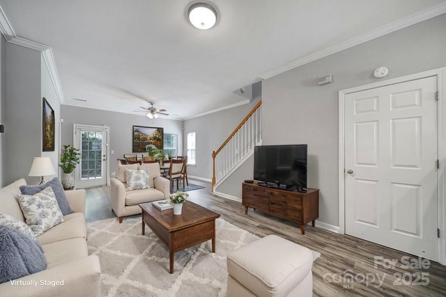 13719 Singleleaf Lane Charlotte, NC 28278 - Photo 8 of 42 a living room with furniture and a flat screen tv