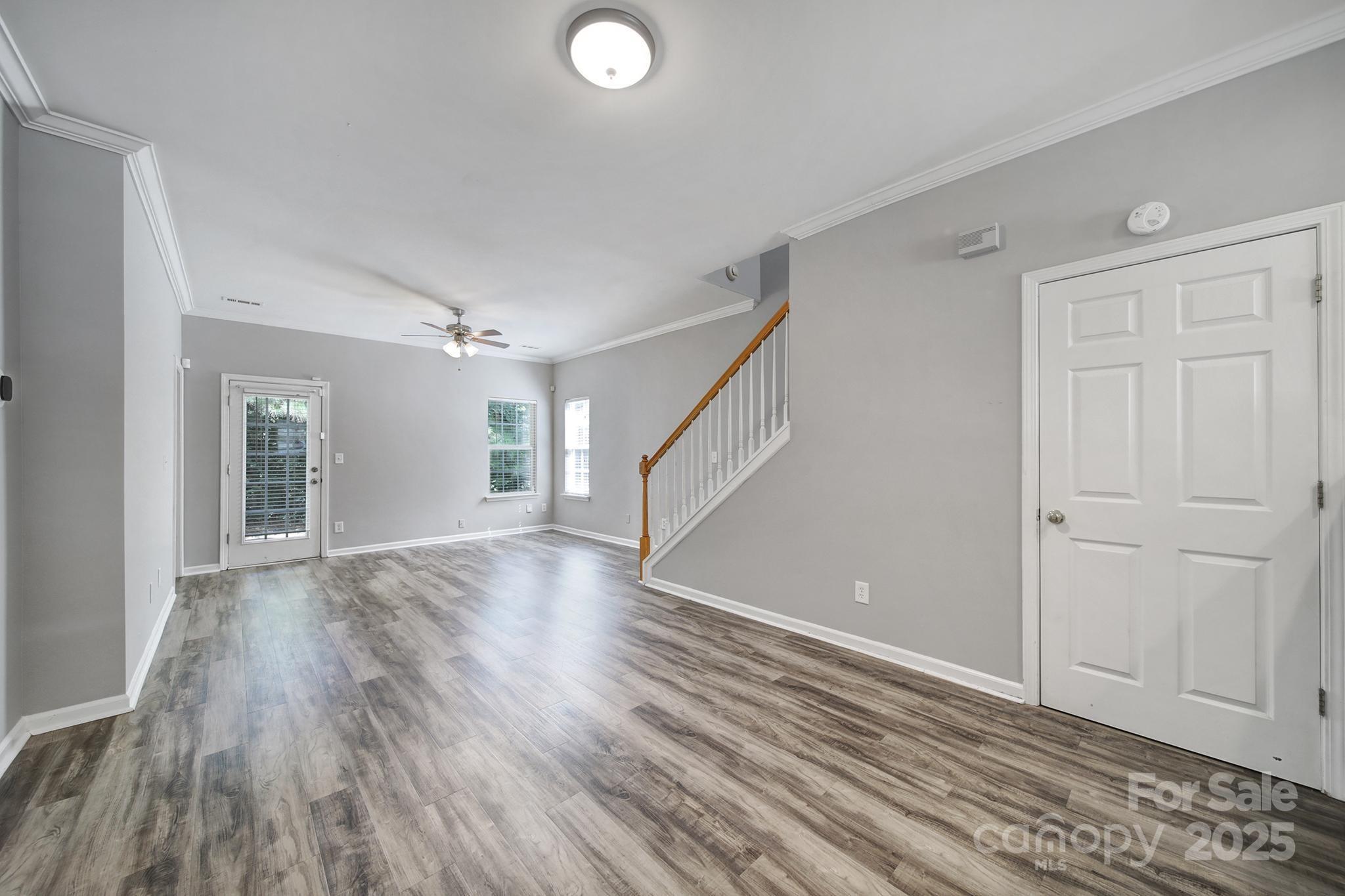 13719 Singleleaf Lane Charlotte, NC 28278 - Photo 9 of 42 a view of an empty room with wooden floor and a window