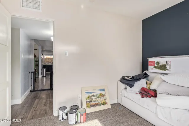 a bedroom with furniture and a bed