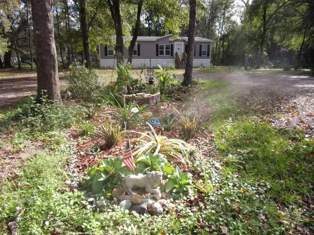 a backyard of a house with lots of green space