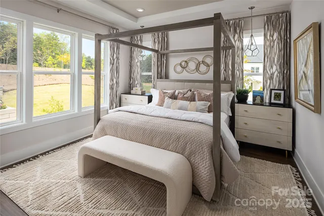 a bedroom with a large bed and a window