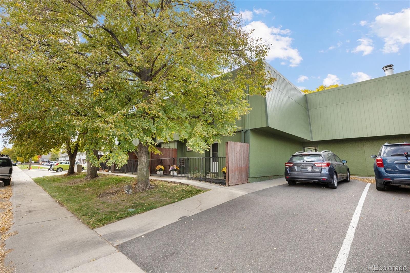 3771 Quail Street Wheat Ridge, CO 80033 - Photo 22 of 25 a car parked in front of a house