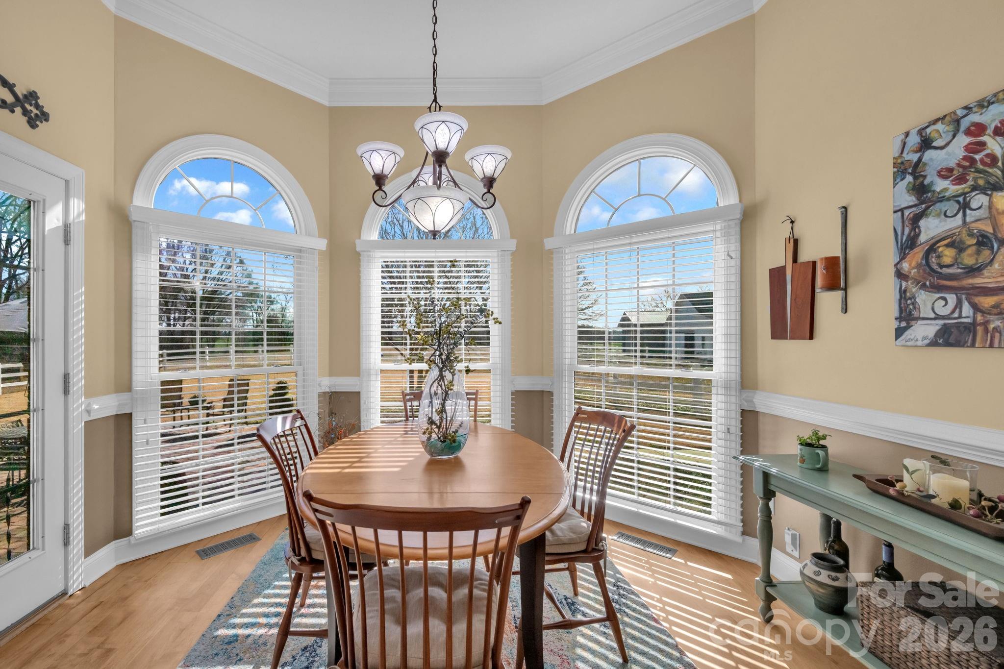 5432 Highway 218 Monroe, NC 28110 - Photo 15 of 48 a view of a dining room with furniture wooden floor and chandelier