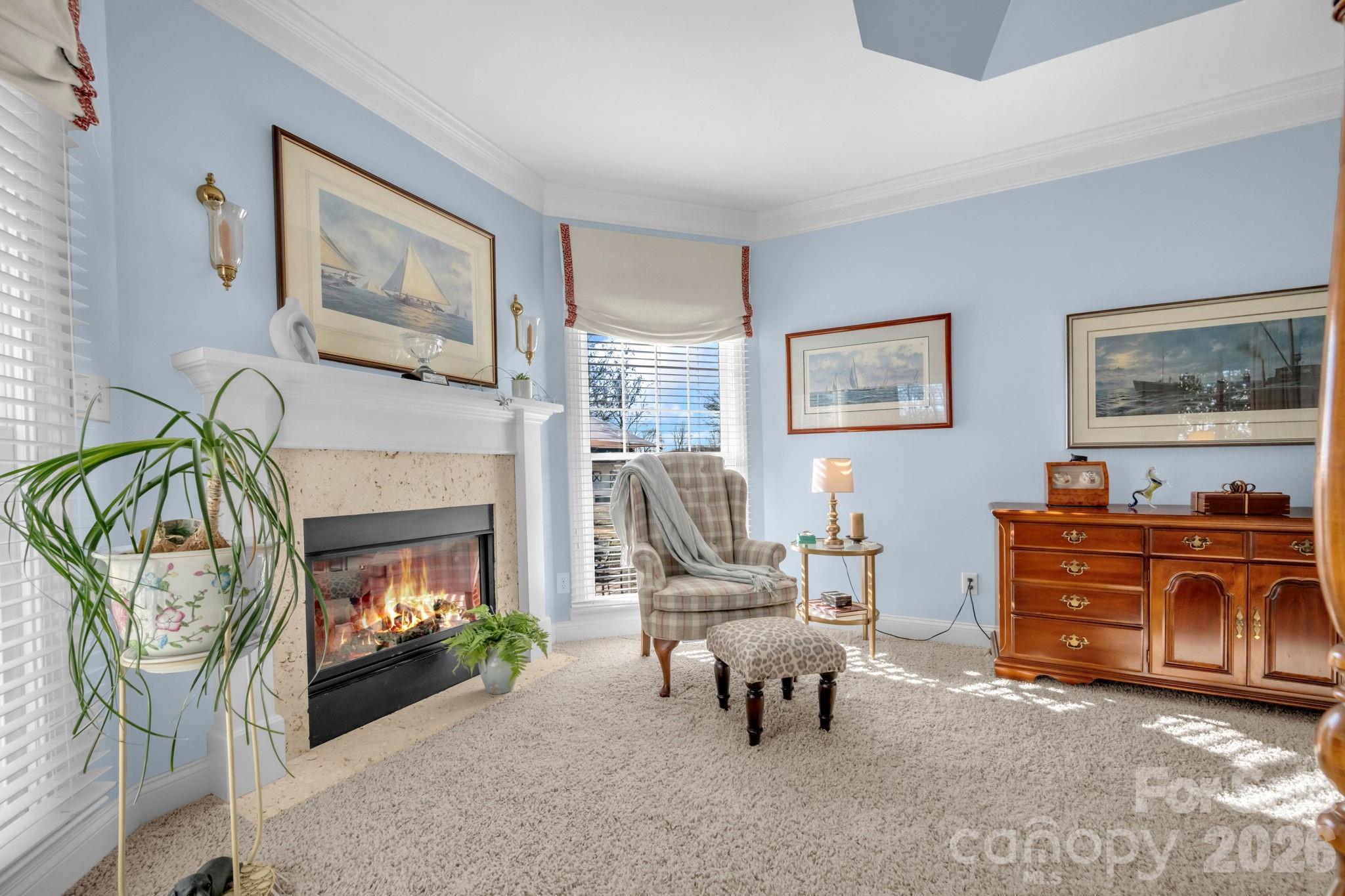 5432 Highway 218 Monroe, NC 28110 - Photo 18 of 48 a living room with furniture a flat screen tv and a fireplace