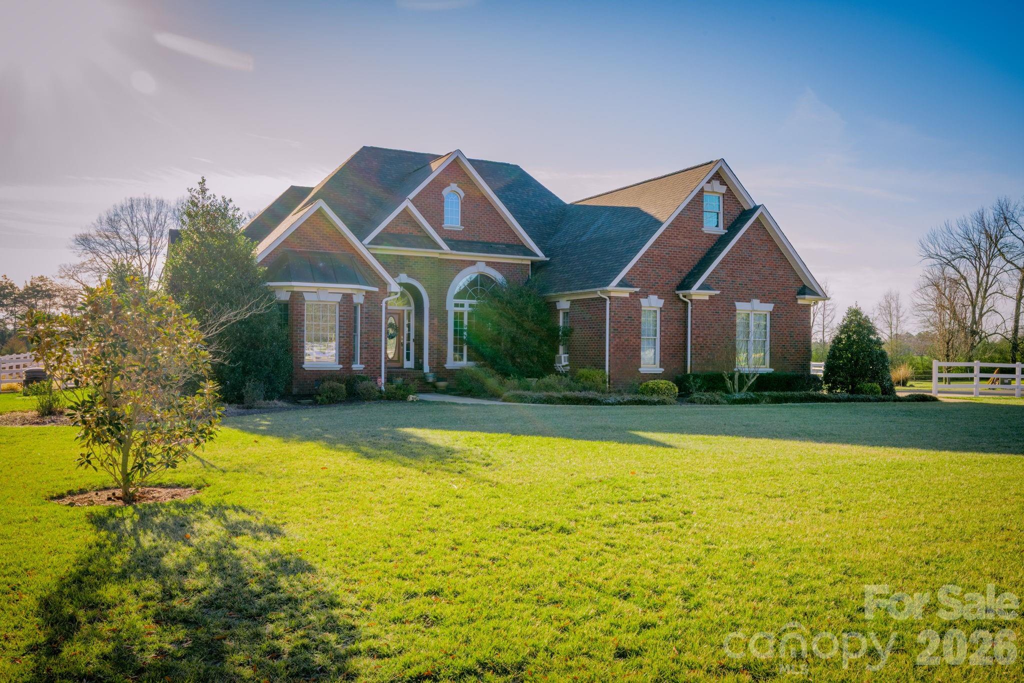 5432 Highway 218 Monroe, NC 28110 - Photo 2 of 48 a front view of a house with swimming pool