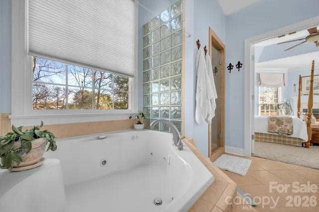 a bathroom with a tub and shower