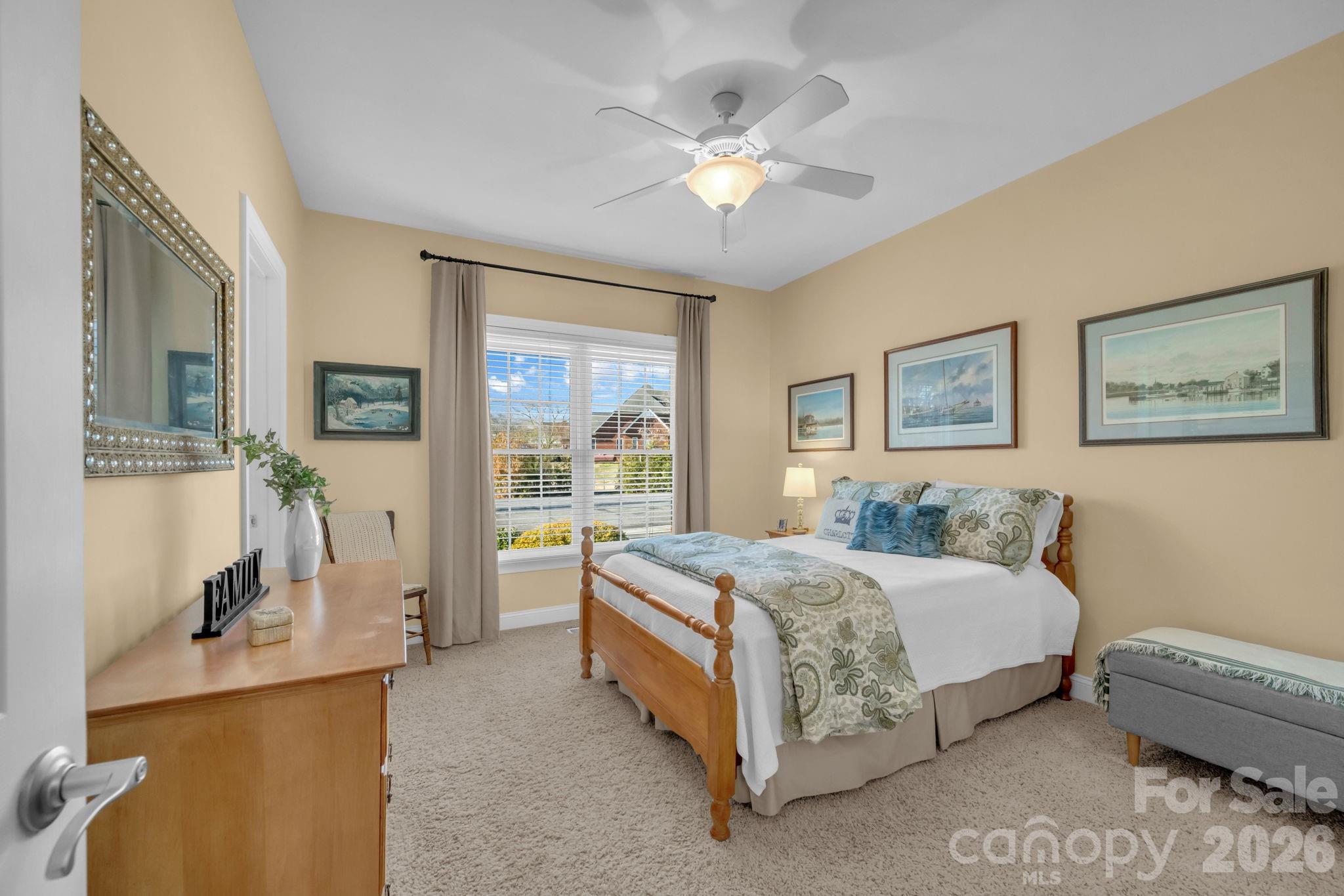 5432 Highway 218 Monroe, NC 28110 - Photo 23 of 48 a bedroom with a bed and a chandelier