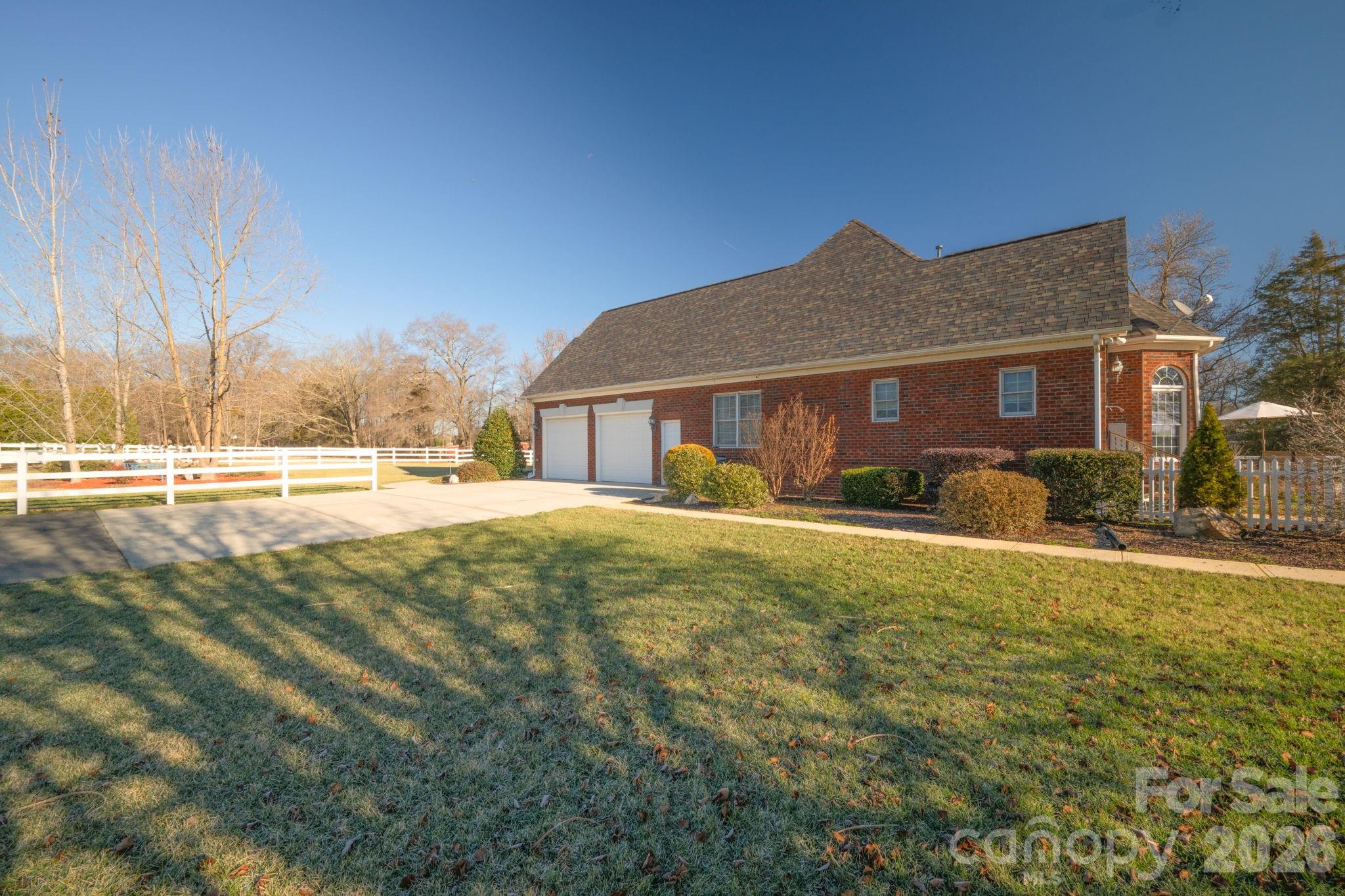 5432 Highway 218 Monroe, NC 28110 - Photo 26 of 48 a front view of a house with garden
