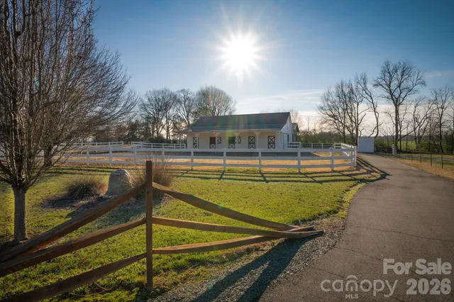 a view of a swimming pool with a yard