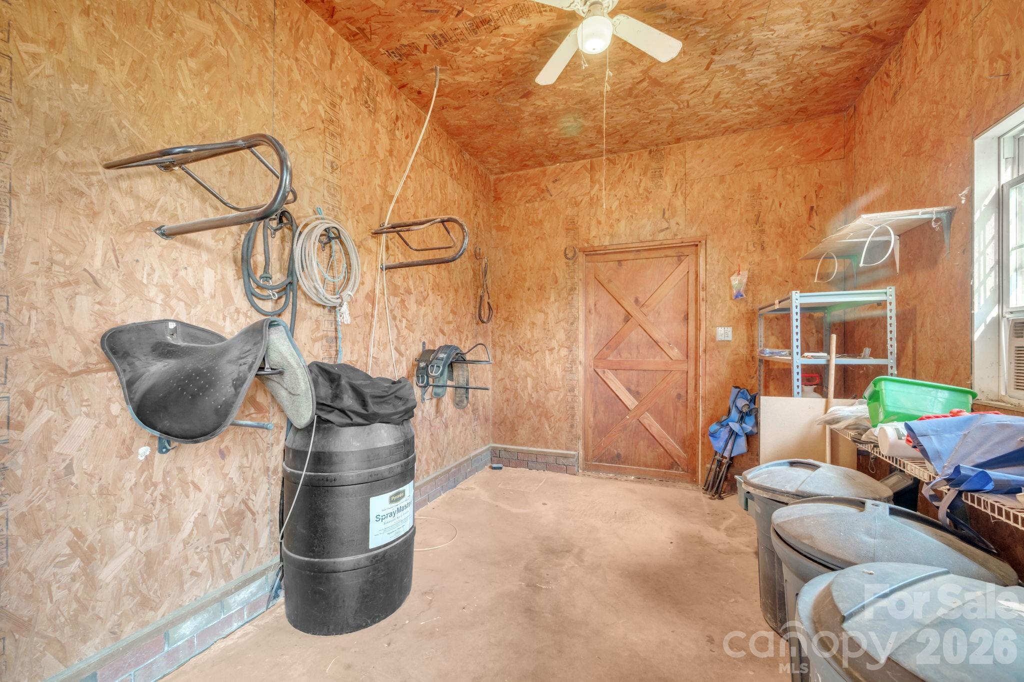 5432 Highway 218 Monroe, NC 28110 - Photo 35 of 48 a living room with furniture and a floor to ceiling window