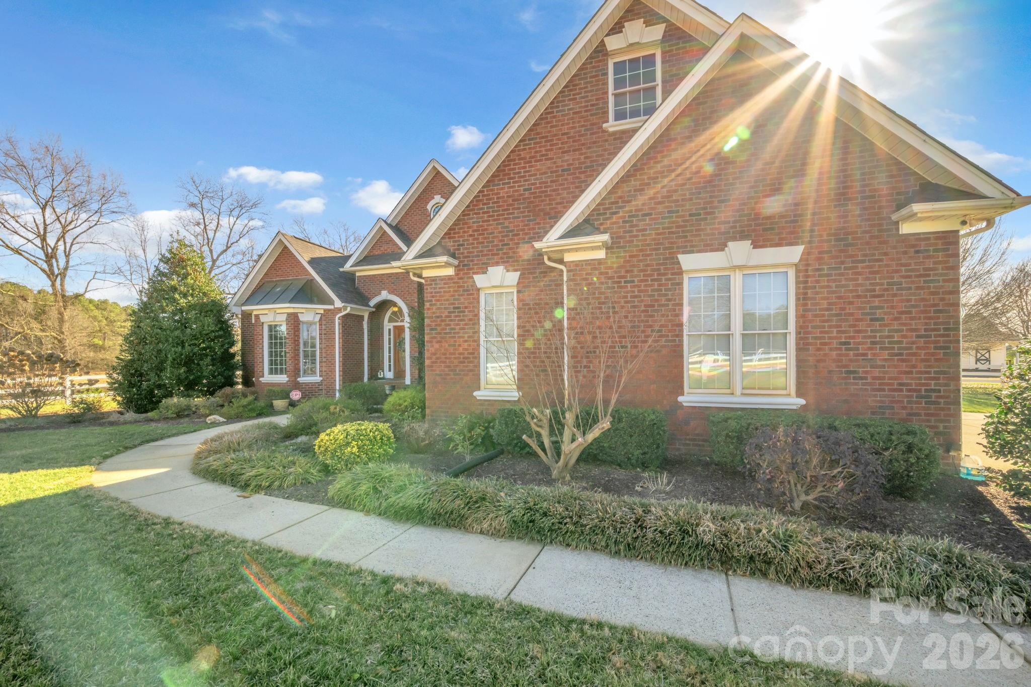 5432 Highway 218 Monroe, NC 28110 - Photo 5 of 48 a front view of a house with garden