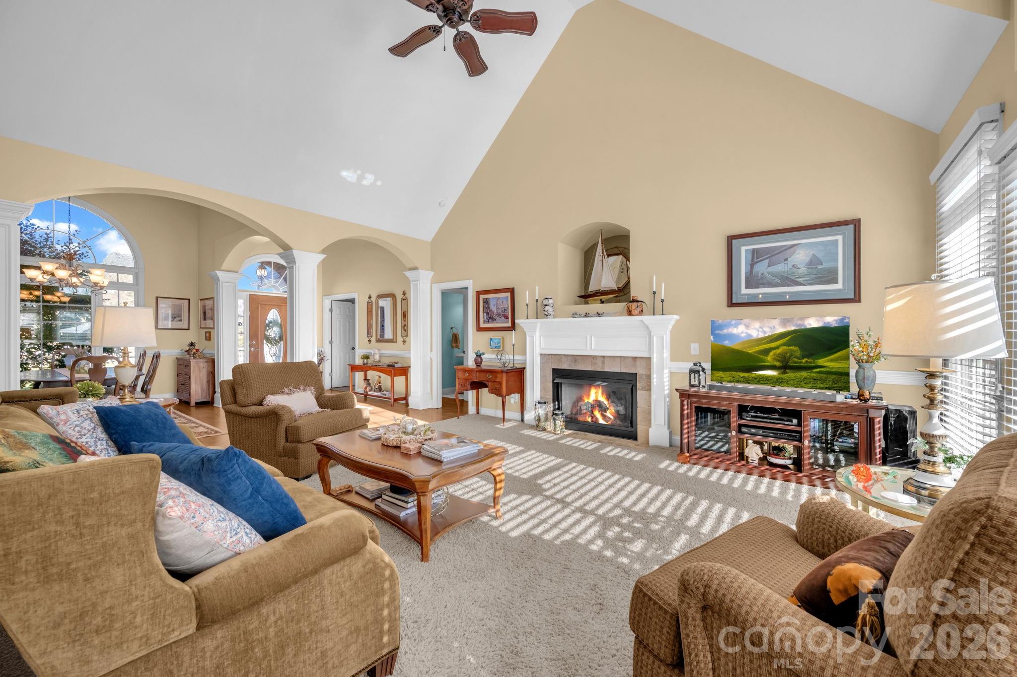 5432 Highway 218 Monroe, NC 28110 - Photo 10 of 48 a living room with furniture a fireplace and a flat screen tv