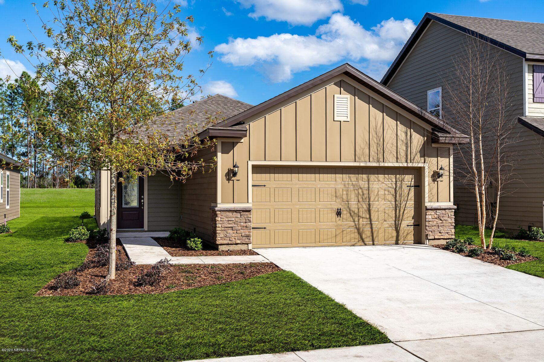 235 Brybar Drive St. Augustine, FL 32095 - Photo 1 of 11 a front view of a house with a yard