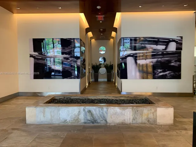 a kitchen with stainless steel appliances granite countertop a stove a sink and a large window