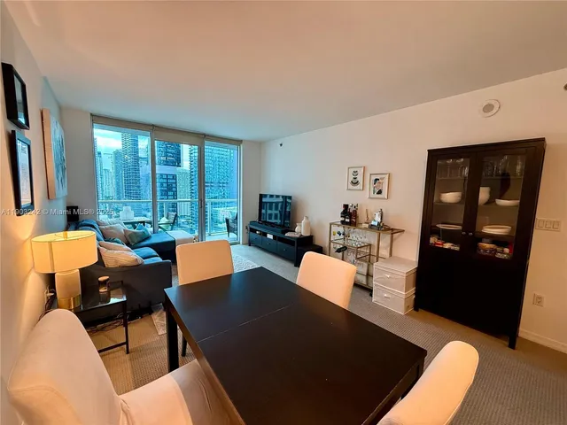 a kitchen with a sink appliances and cabinets