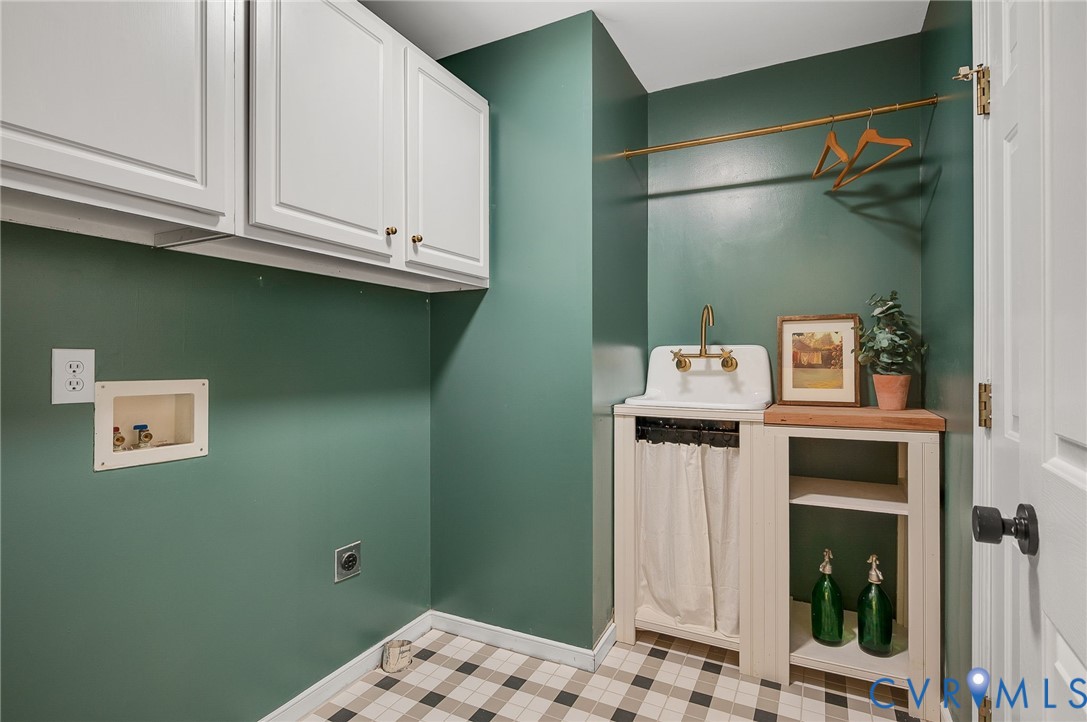 2620 Academy Road Powhatan, VA 23139 - Photo 18 of 49 a bathroom with a sink and a mirror