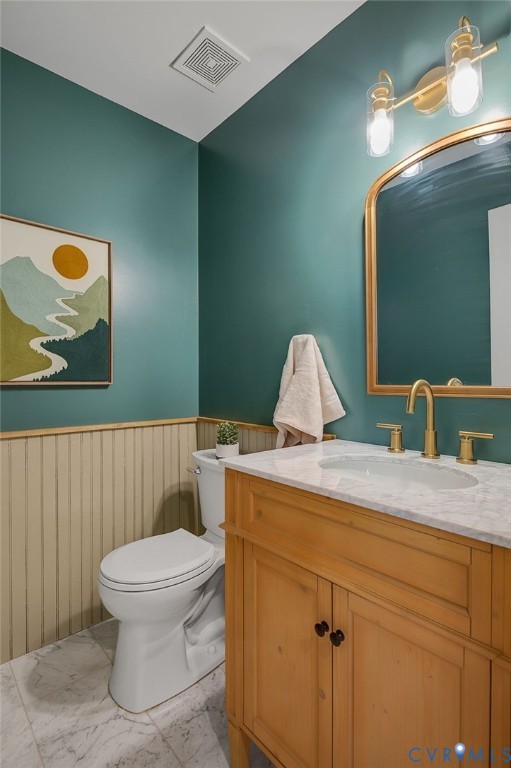 2620 Academy Road Powhatan, VA 23139 - Photo 20 of 49 a bathroom with a toilet sink vanity and mirror