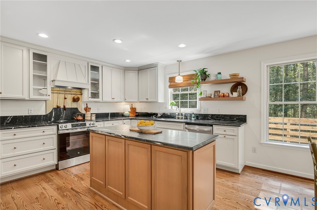 2620 Academy Road Powhatan, VA 23139 - Photo 21 of 49 a kitchen with stainless steel appliances granite countertop a stove a sink dishwasher and a refrigerator