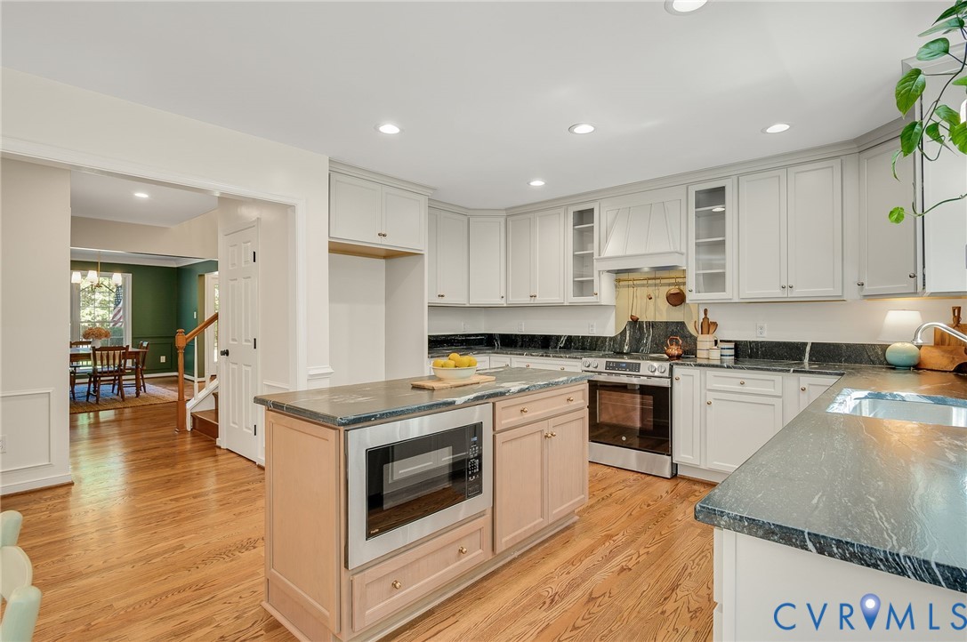 2620 Academy Road Powhatan, VA 23139 - Photo 23 of 49 a kitchen with a stove a sink and a refrigerator