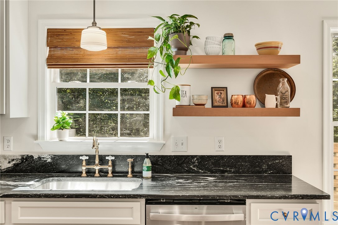 2620 Academy Road Powhatan, VA 23139 - Photo 24 of 49 a kitchen with granite countertop a stove a sink and a window