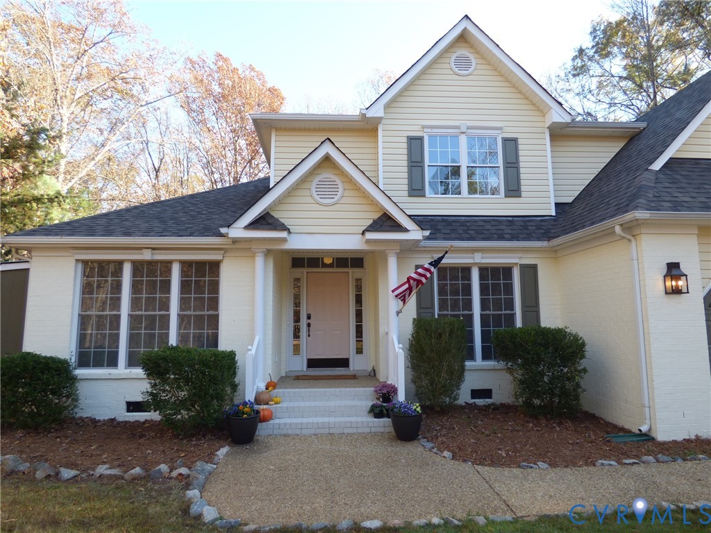 2620 Academy Road Powhatan, VA 23139 - Photo 3 of 49 a front view of a house with garden