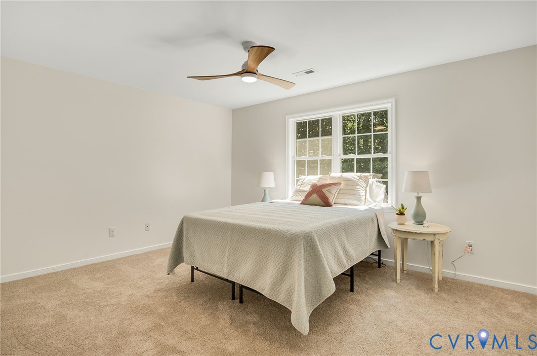 2620 Academy Road Powhatan, VA 23139 - Photo 33 of 49 a bedroom with a bed and a window