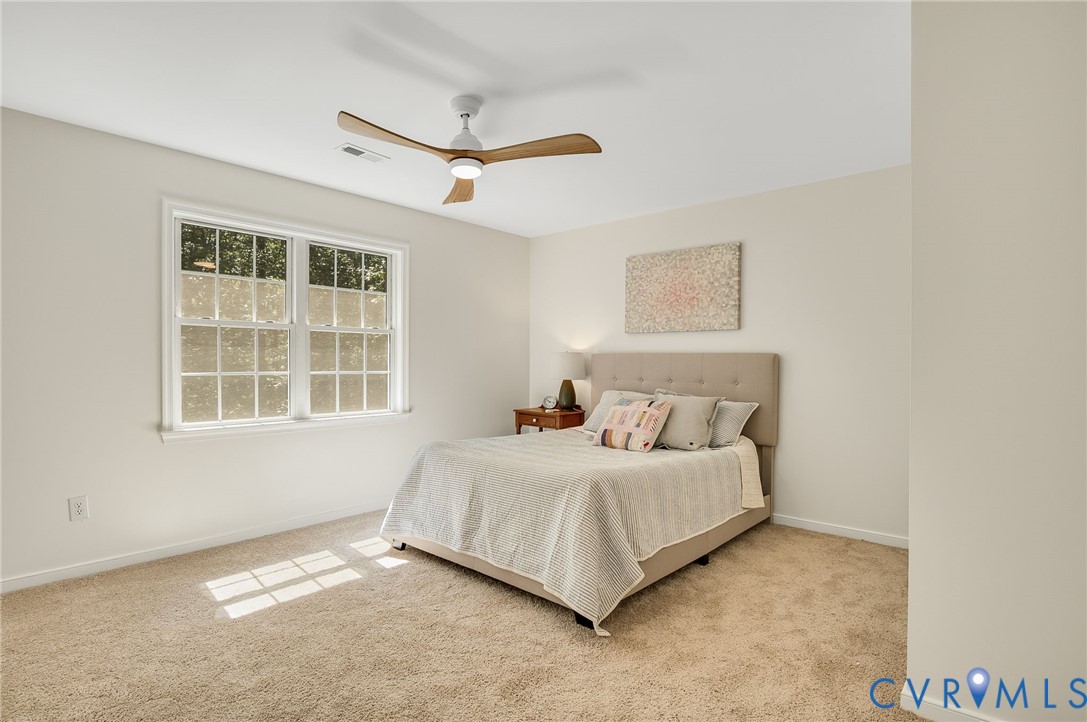 2620 Academy Road Powhatan, VA 23139 - Photo 34 of 49 a bedroom with a bed and a window