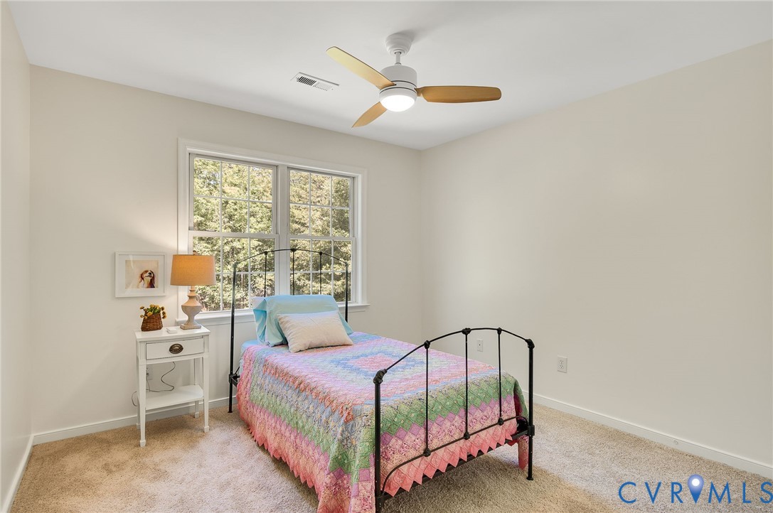 2620 Academy Road Powhatan, VA 23139 - Photo 37 of 49 a bedroom with a bed and a window