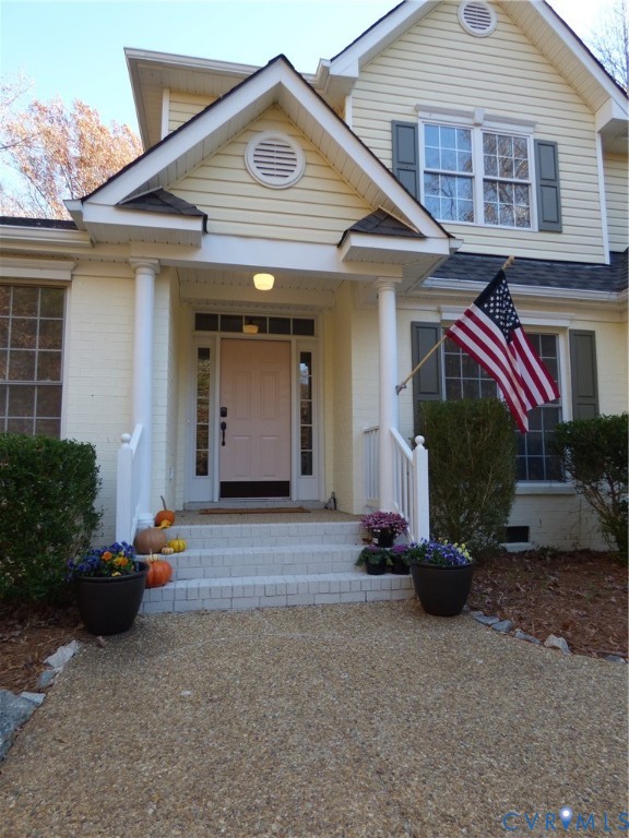 2620 Academy Road Powhatan, VA 23139 - Photo 4 of 49 a front view of a house with a yard