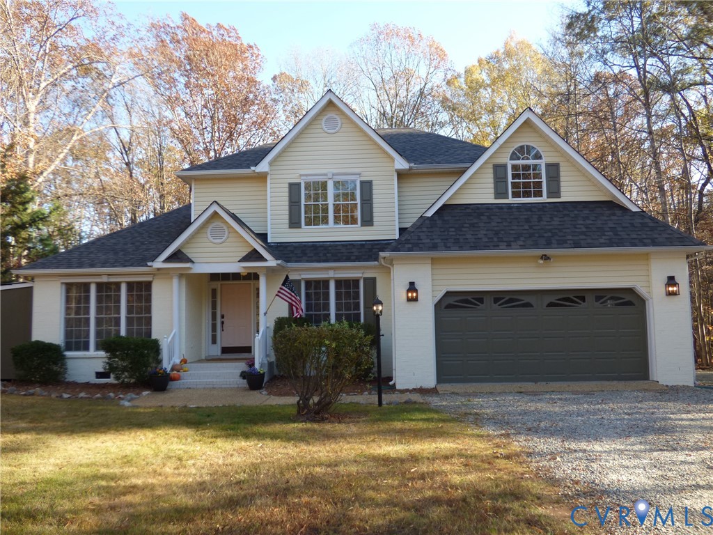 2620 Academy Road Powhatan, VA 23139 - Photo 42 of 49 a front view of a house with a yard and garage