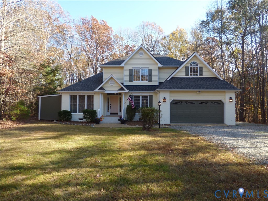 2620 Academy Road Powhatan, VA 23139 - Photo 44 of 49 a front view of a house with a yard and garage