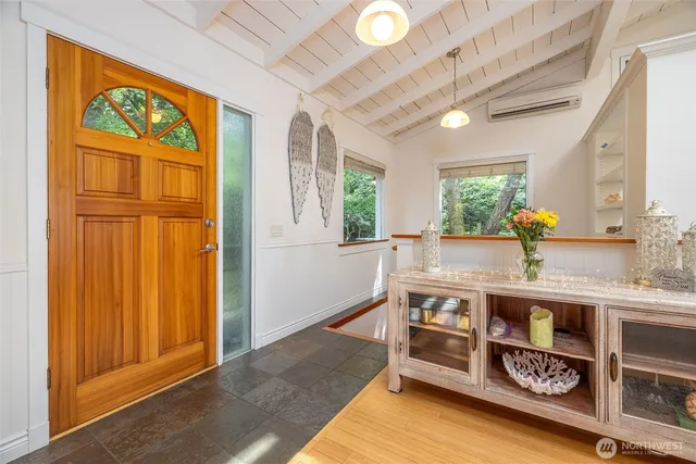 a room with wooden furniture and window