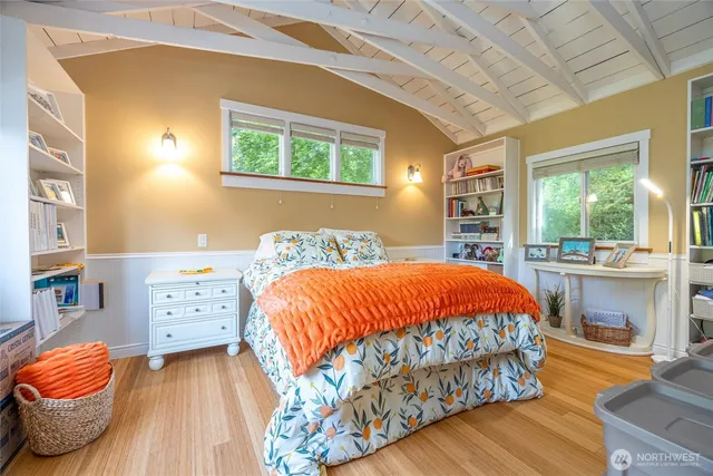 a bedroom with a bed and a window