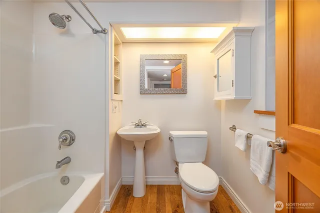 a bathroom with a toilet a sink and bathtub