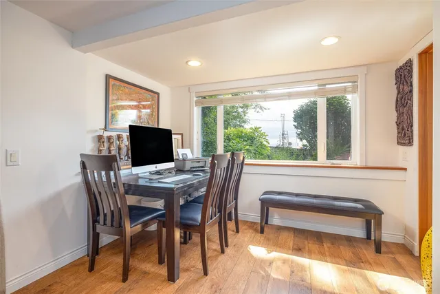 a view of a dining room with furniture window and outside view