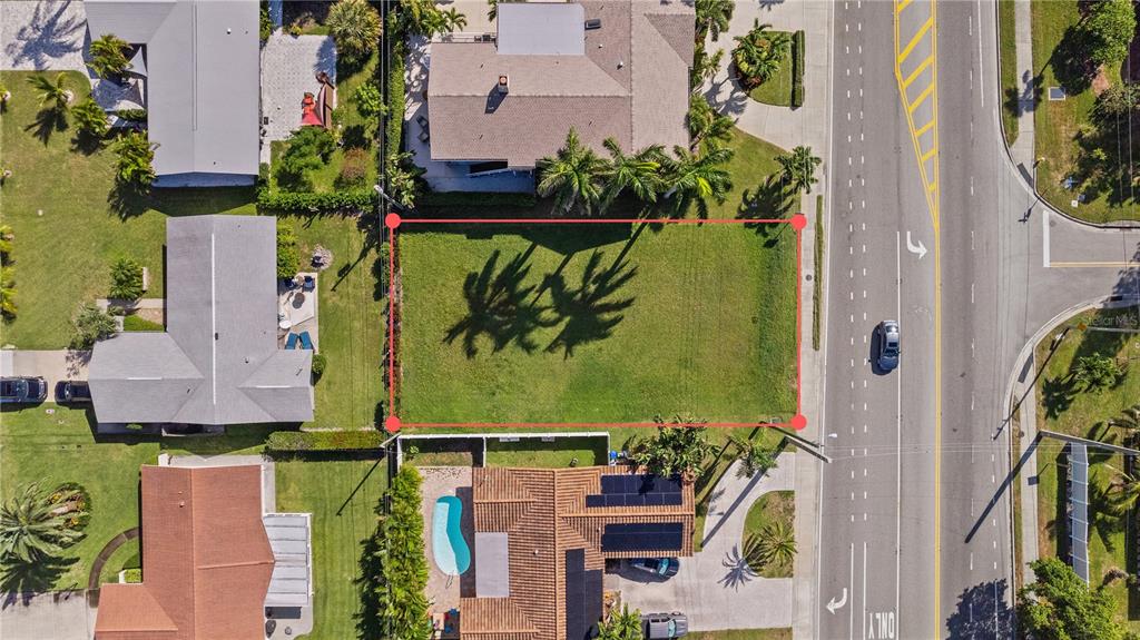 Causeway Boulevard Belleair Beach, FL 33786 - Photo 1 of 9 an aerial view of a house with a garden and swimming pool